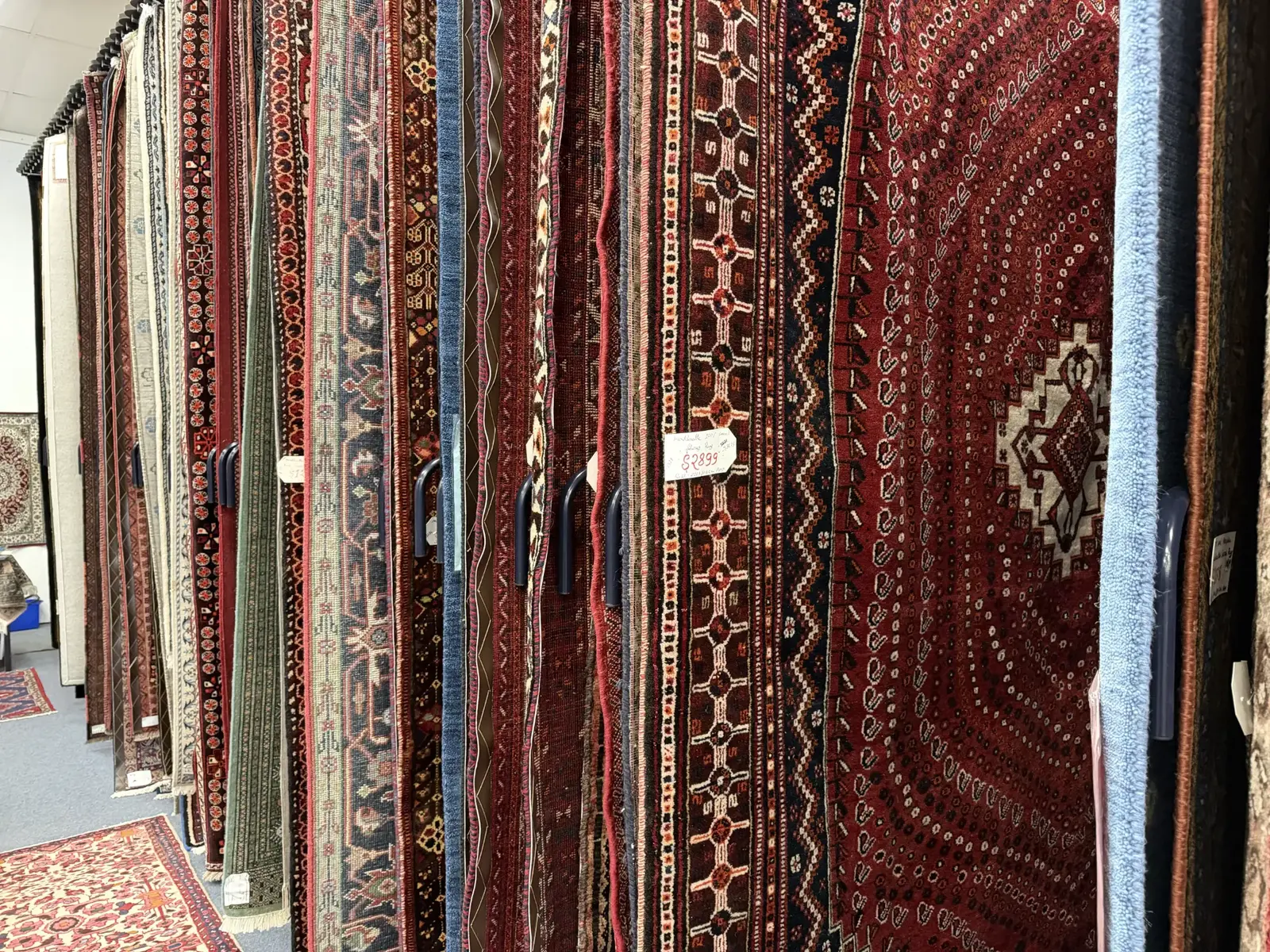Handmade rugs and runners displayed throughout the showroom