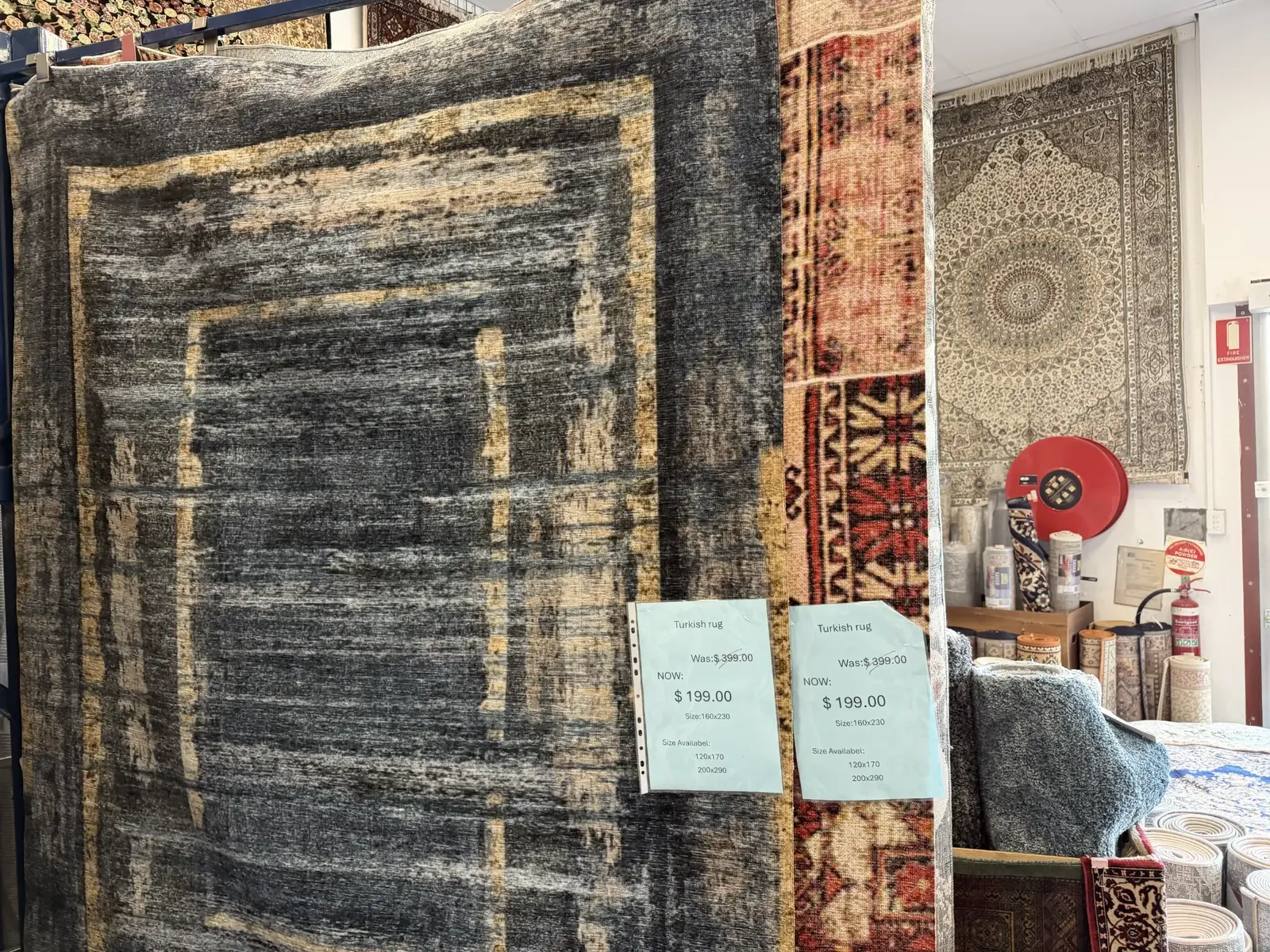 Machine washable Turkish-style rugs hanging in the showroom
