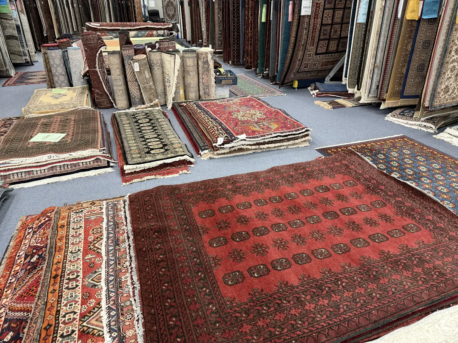 Silk and handmade rugs and runners inside the Birtinya showroom